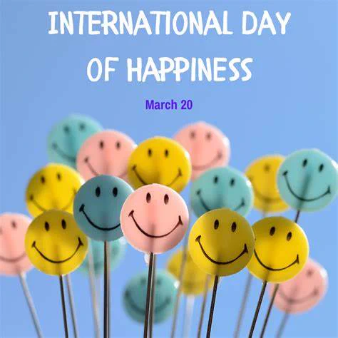  A cluster of pastel-colored smiley face lollipops in yellow, blue, and pink, each attached to thin sticks, set against a soft blue background. Above them, bold white text reads 'INTERNATIONAL DAY OF HAPPINESS,' with 'March 20' written in smaller purple font below.
