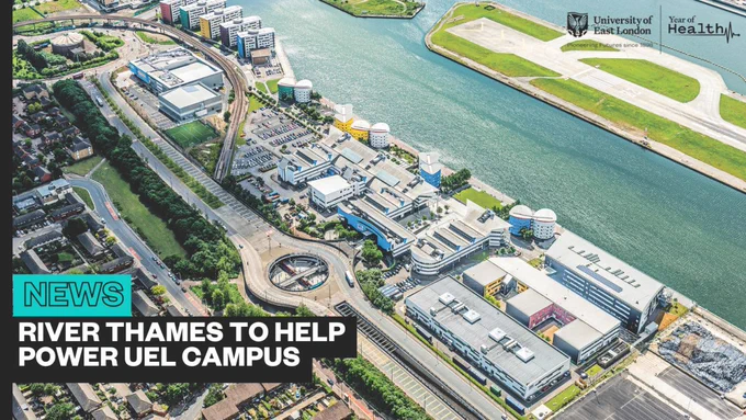 Aerial view of the University of East London campus next to the River Thames, featuring modern buildings and surrounding waterways. Headline reads 'River Thames to help power UEL campus'.