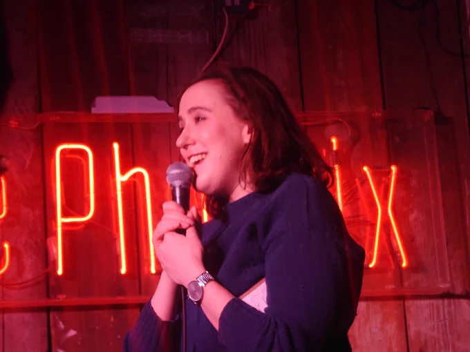 Charlie smiling onstage