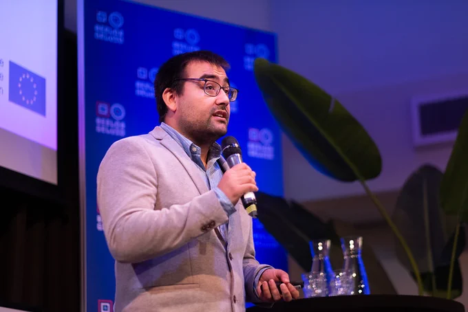 A young man holding a microphone