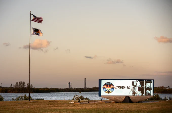 NASA Commercial Crew Program employees raise the agency’s SpaceX Crew-10 mission flag near the countdown clock at the NASA News Center at the agency’s Kennedy Space Center in Florida on Monday, March 10, 2025.

NASA/Ben Smegelsky