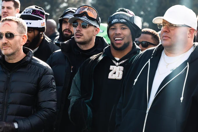 Picture of Saquon Barkley, Dom DiSandro, and Howie Roseman of the Philadelphia Eagles at the Super Bowl LIX Championship celebration.