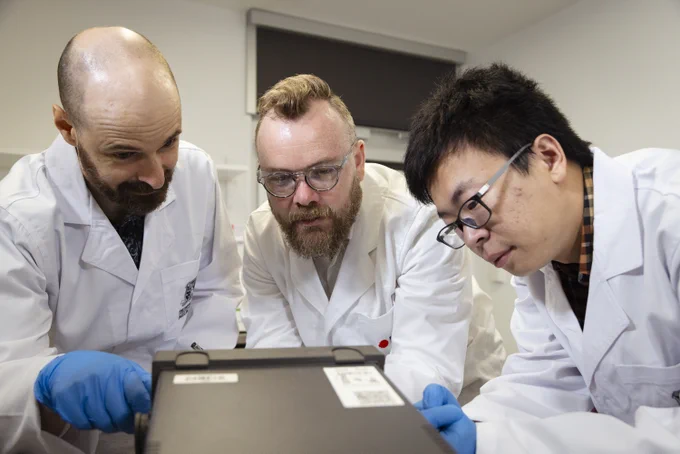 The team behind the water charging experiment: Dr Joe Berry, Dr Peter Sherrell and PhD scholar Shuaijia Chen (left to right) in a lab at RMIT University. 