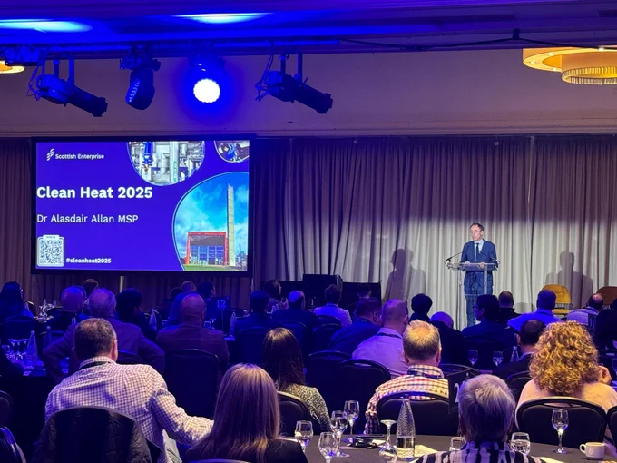 An image of  Acting Climate Action Minister Alasdair Allan speaking to the crowd at the Clean Heat conference. 