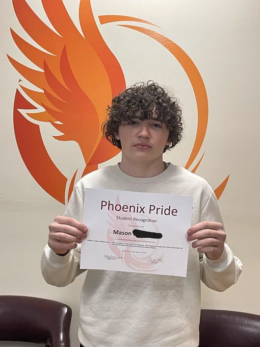 student with certificate
