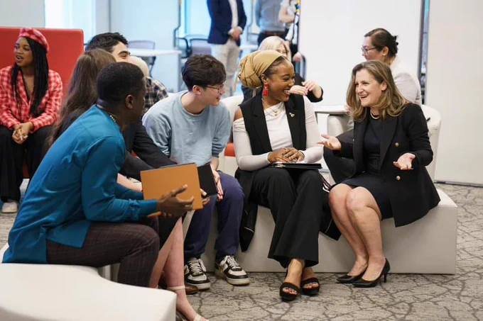 Chrystia Freeland talking to a group of young people.