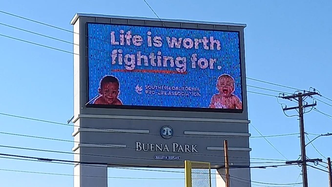 Billboard in Buena Park, CA displaying message, "Life is worth fighting for."