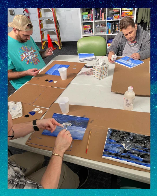 Job One Community-Based Day Services participants painting their own version of Starry Night.