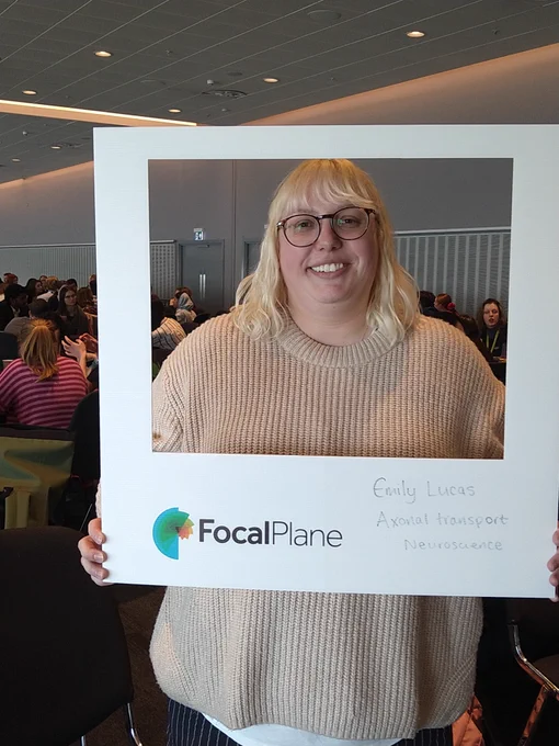 Picture of Emily Lucas using a polaroid-style selfie frame, with the FocalPlane logo and the text, 'Axonal transport' and 'Neuroscience'.