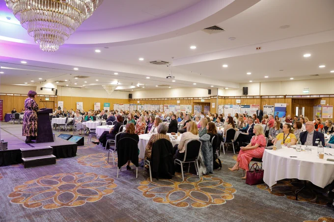 A wide picture of the Regional Maternity and Neonatal Conference in a hotel function room.