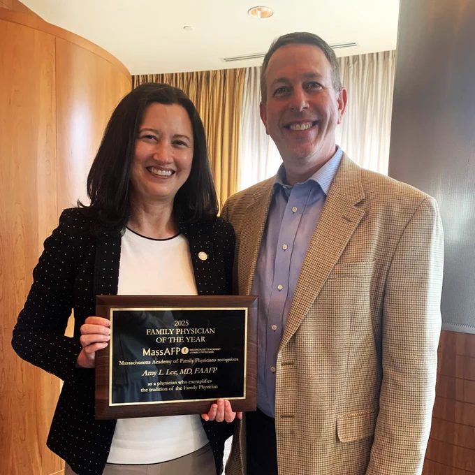 Dr. Amy Lee and Dr. Altman smile together for Dr. Lee's award.