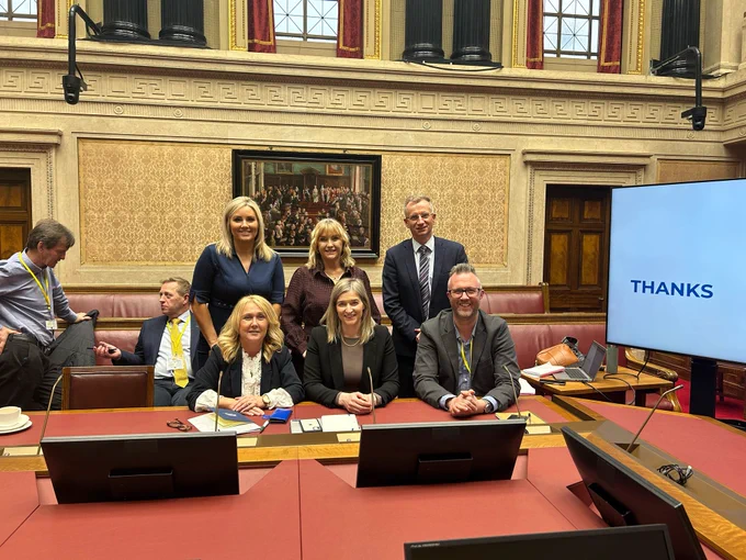 Photo of Diane Forsythe MLA, Celine McStravick, Brian Kingston MLA,  Ciara Ferguson MLA, Nicola Brogan MLA and Jonny Currie, pictured in the Senate Chamber following the APG on the Voluntary and Community Sector.
