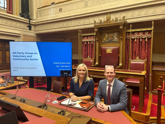 Photo of Diane Forsythe MLA and Communities Minister Gordon Lyons MLA, pictured in the Senate Chamber following the APG on the Voluntary and Community Sector.