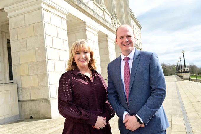 Minister Gordon Lyons is pictured with Celine McStravick, Chief Executive of NICVA outside Stormont.