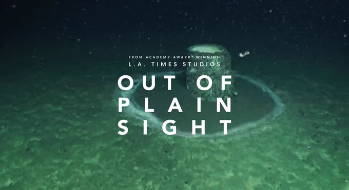 A barrel of DDT sits on the ocean floor. Text on screen reads "From Academy Award Winning L.A. Times Studios" "Out of Plain Sight"