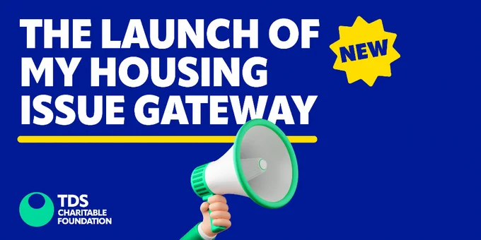 Promotional image for the launch of the My Housing Issue Gateway by TDS Charitable Foundation. Features a megaphone with the announcement text, accentuated by a blue background and a yellow 'NEW' starburst icon.