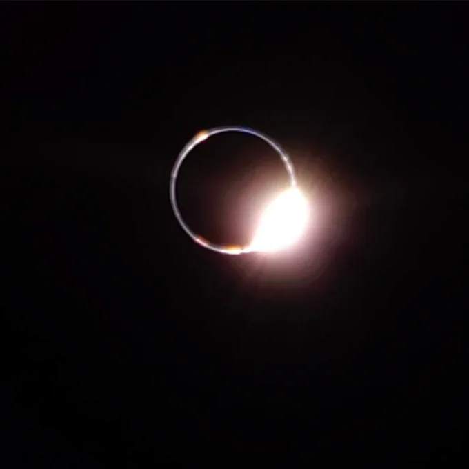 The solar eclipse as seen from the surface of the Moon in Mare Crisium by the Blue Ghost Mission 1 lander. The Sun's corona shines as a bright circle around the dark disc of the Earth. A "diamond ring" flare glows at the five o'clock position against the darkness of space. Credit: Firefly Aerospace
