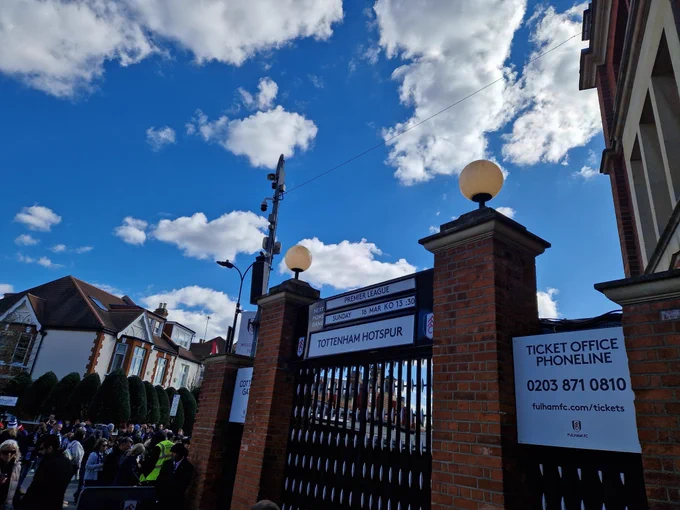 TOTTENHAM HOTSPUR shows as the next Fulham home game on the board outside the Cottage on Stevenage Road 