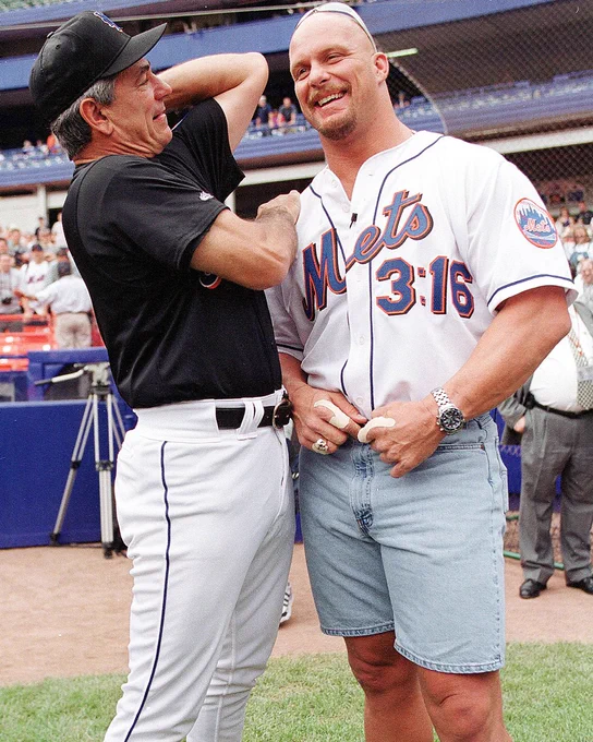 Bobby Valentine and Stone Cold Steve Austin talk prior to the game between the New York Yankees and the New York Mets. Austin wears a white Mets jersey with “3:16” on the jersey.