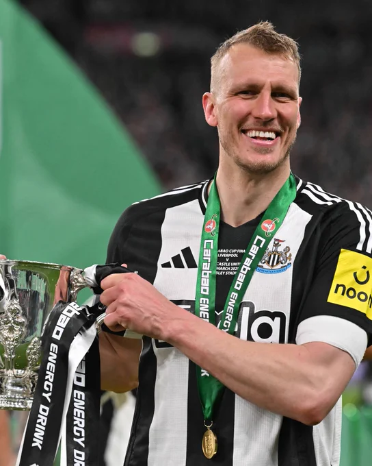 Dan Burn holding the Carabao Cup trophy