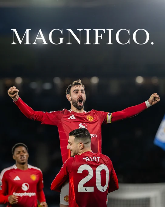 Diogo Dalot holds Bruno Fernandes aloft following his goal against Leicester City.
