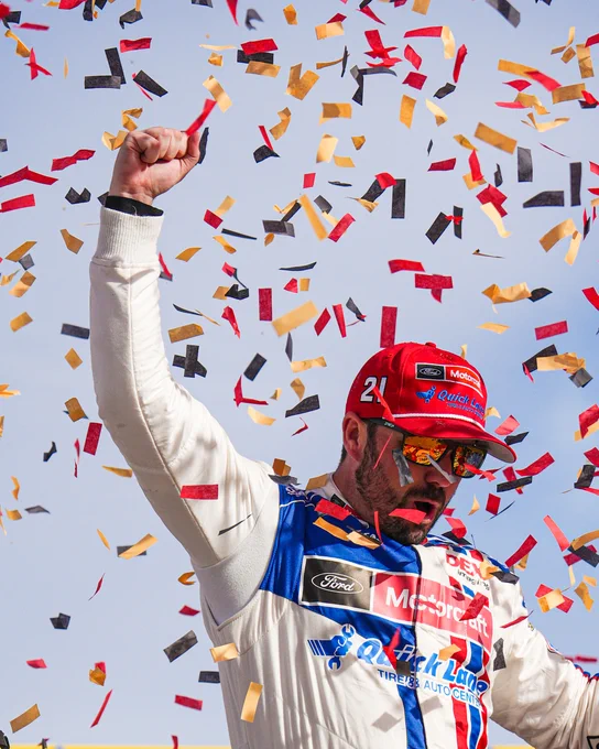 Josh Berry celebrates in Victory Lane at Las Vegas while confetti falls around him.