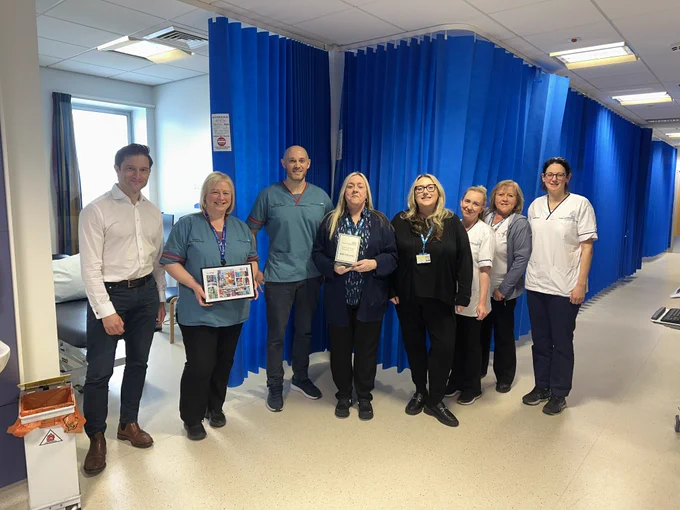 The Musculoskeletal (MSK) team with their Team of the month award presented by Medical Director, Harry Rourke. 