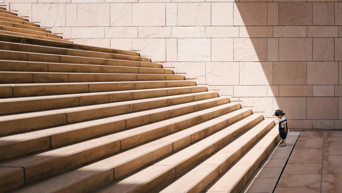 A picture of a young boy at the bottom of a very large staircase that goes up and away out of sight. 

Wondering what's next once you're a software engineer? Check my #podcast on career boundary conditions—4 episodes in, wanting your feedback. More at https://matthewsinclair.com/blog/0175-whatnext-podcast-next-steps #whatnext