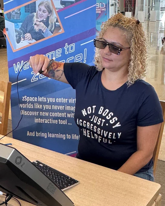 Photo of customer using the free zSpace computers at Windmill Library. 