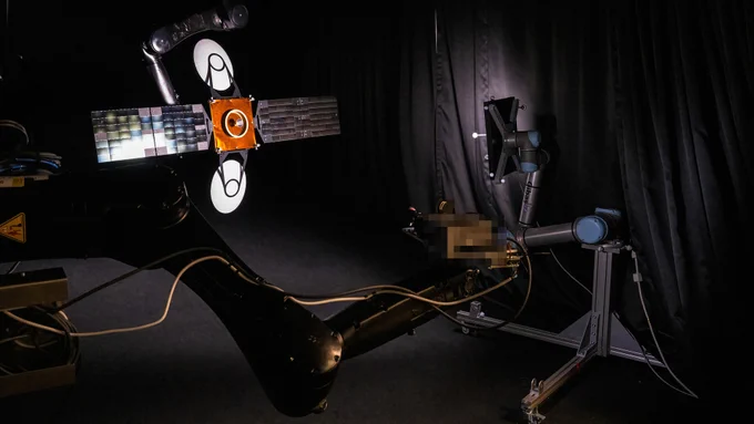 Satellite model plus camera used to simulate close approach in space