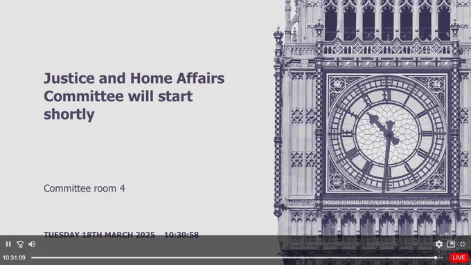 A screenshot of a waiting page for the Justice and Home Affiairs committee. There is an off-white page with the committee title, room and date (Tuesday 18th March 2025) besides a dark blue illustration of  Big Ben's clock face.
