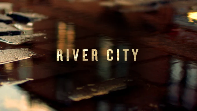 River City is written in block capitals against the backdrop of wet cobblestones
