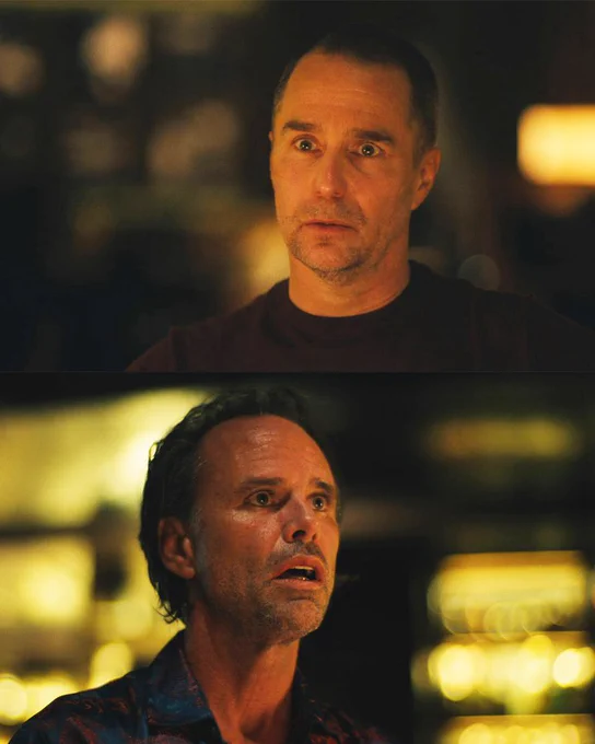 White lotus still image. Sam Rockwell talking while Walton Goggins looks on, incredulous.