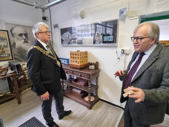 The Lord Mayor of Birmingham and a staff member of ACME Whistles.