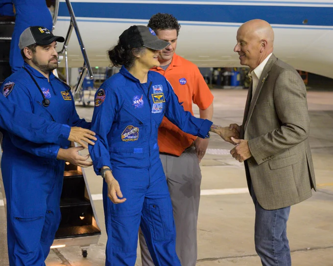 NASA astronaut Suni Williams returns to Johnson Space Center's Ellington Field and is greeted by Steve Koerner, Johnson's acting center director. Credit: NASA/Robert Markowitz