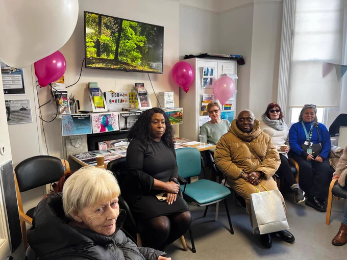 women sitting in a room celebrating international women's day