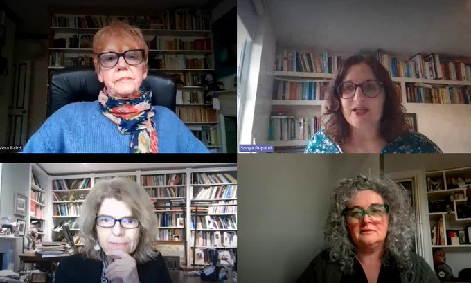 In a screenshot of a Team's webinar, four women are shown in their respective windows. Each sits in front of book shelves and look directly at the screen. 