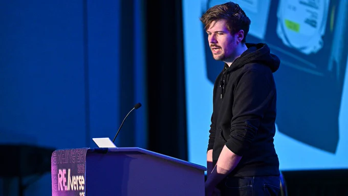 Markus Gaasedelen presents Full-stack Reverse Engineering of the Original Microsoft Xbox on-stage at the inaugural RE//verse 2025 conference. 