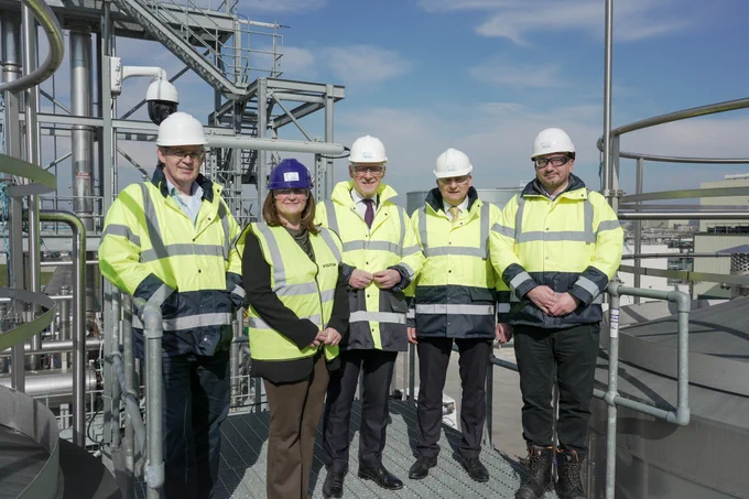First Minister John Swinney stands alongside Mark Simmers, CEO, Celtic Renewables, Jim Gibson, COO, Celtic Renewables, Jane Martin, Managing Director, Customer Operations, Scottish Enterprise and other staff from Celtic Renewables on a visit to the company's facility in Grangemouth. 