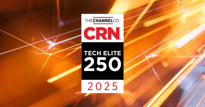 CRN's 2025 Tech Elite 250 badge, a vertical rectangle that says, "CRN Tech Elite 250 2025," is set against a gold background with what appear to be out-of-focus fast moving yellow and white rays of light.