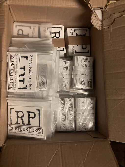 80 packets w/ 10 little stickers & 6 big #RupturePress stickers & big stacks of much more. All the stickers are black and white.
