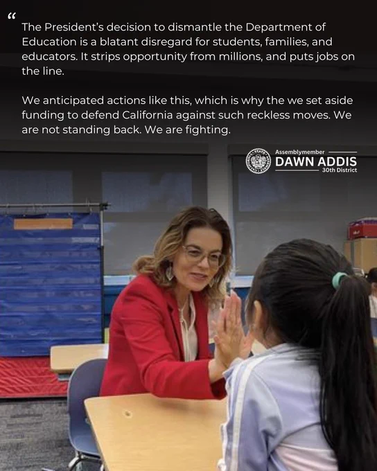 High-fiving a student while sitting at a table. Includes part of my statement that is in my post.