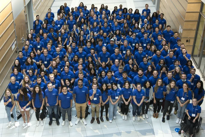 Medical students in the UB Class of 2025 stand together in the Jacobs School atrium