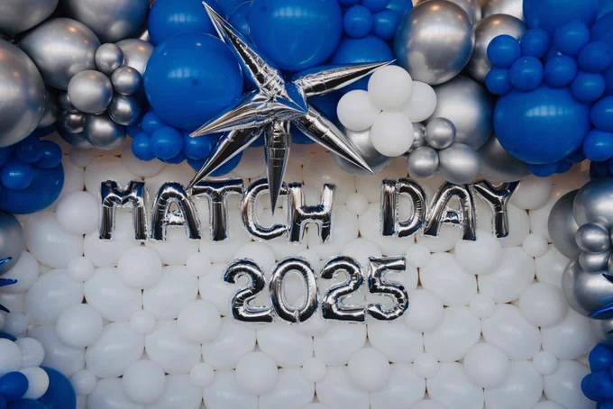 "Match Day 2025" is spelled out in festive balloons