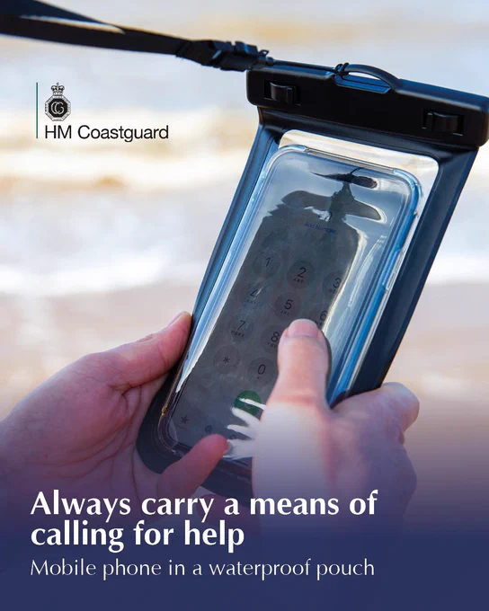 A person at the beach is calling 999 on their mobile phone, which is placed inside a waterproof pouch.

Text reads - Always carry a means of calling for help