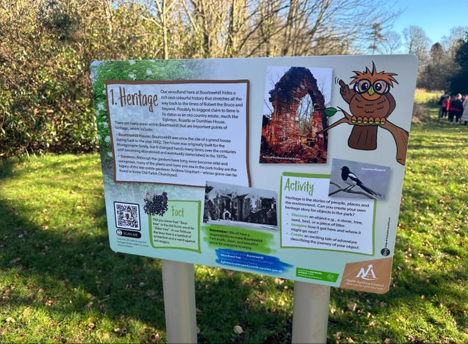 Heritage signage with owl, magpie and QR code, on the new Bourtreehill Park Woodland Trail
