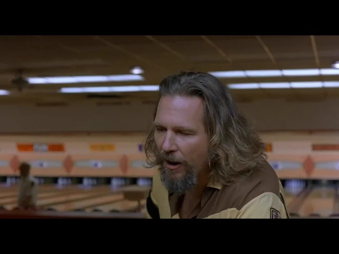 Seated at the bowling alley bar, the Dude now turns back to address the unseen bartender, Gary, in front of him.