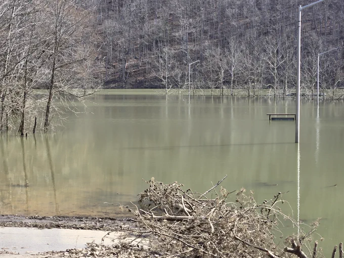 Flood waters at Longbow Boat Ramp are almost to the top of the informational bulletin board.