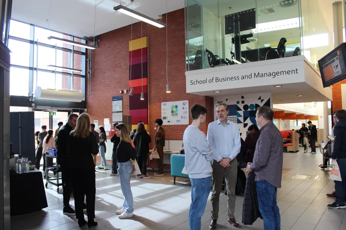Photographs showing guests at our Applicant Visit Day, interacting with our professors and student ambassadors and attending information sessions 