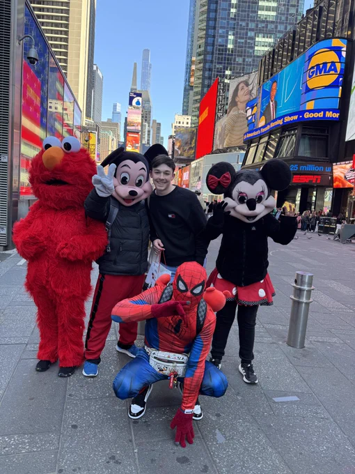 Lewis with Elmo, Mickey, Minnie, and spider-man in times square